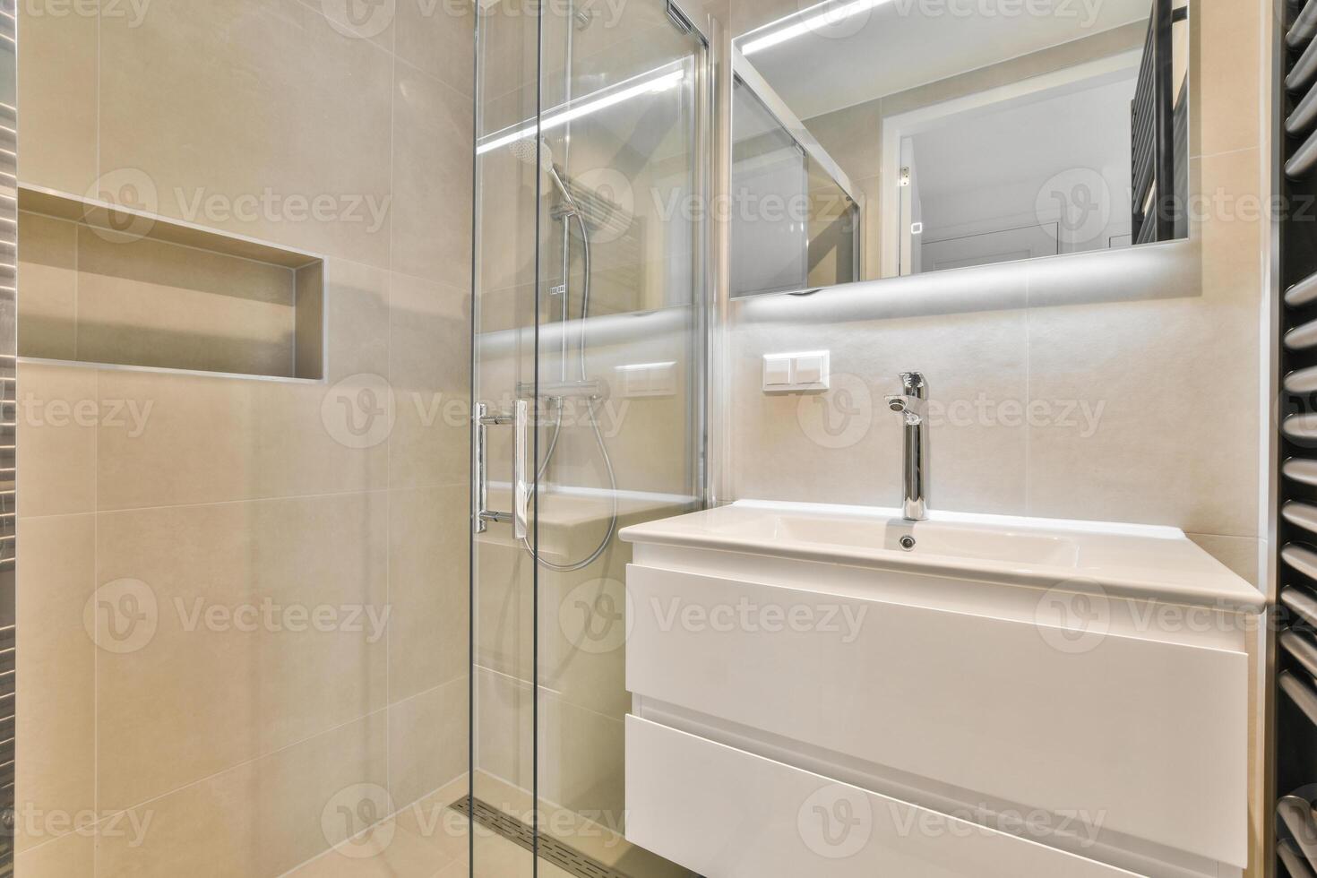 A bathroom with a sink and a shower stall photo