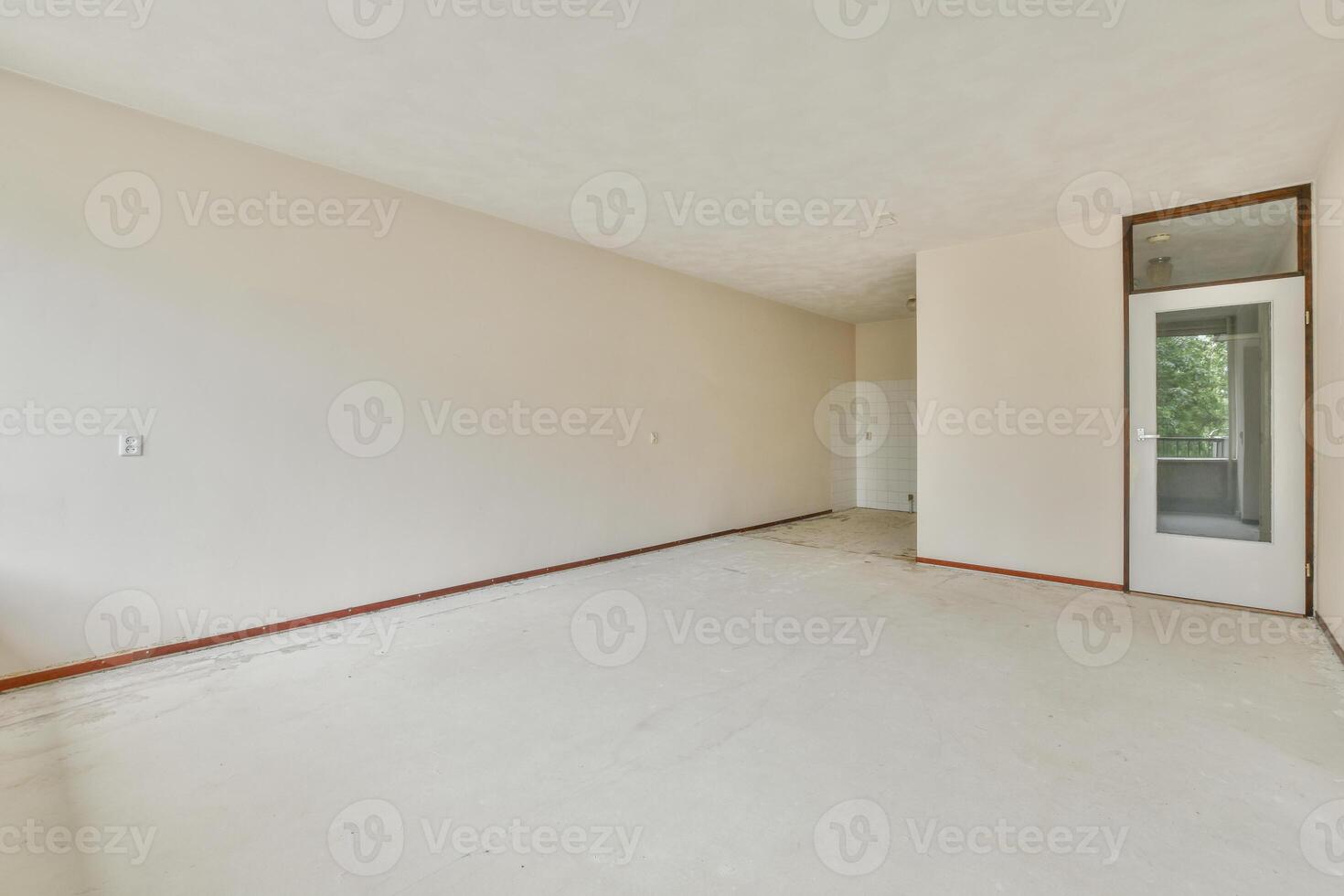 An empty room with a door and a window photo