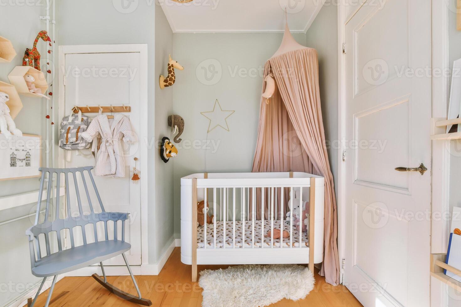 A baby's room with a crib, rocking chair and a rocking horse photo