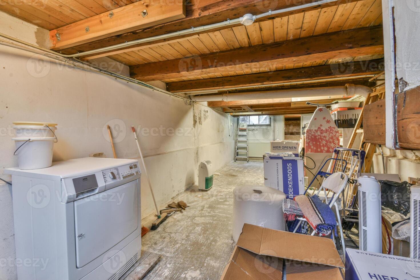 A laundry room with a washer and dryer photo
