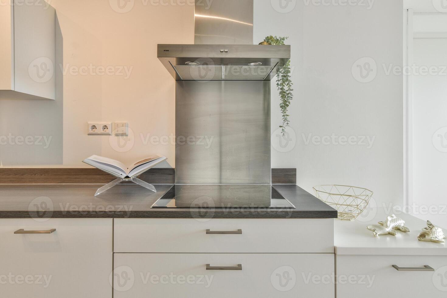A kitchen with a stove and a sink photo