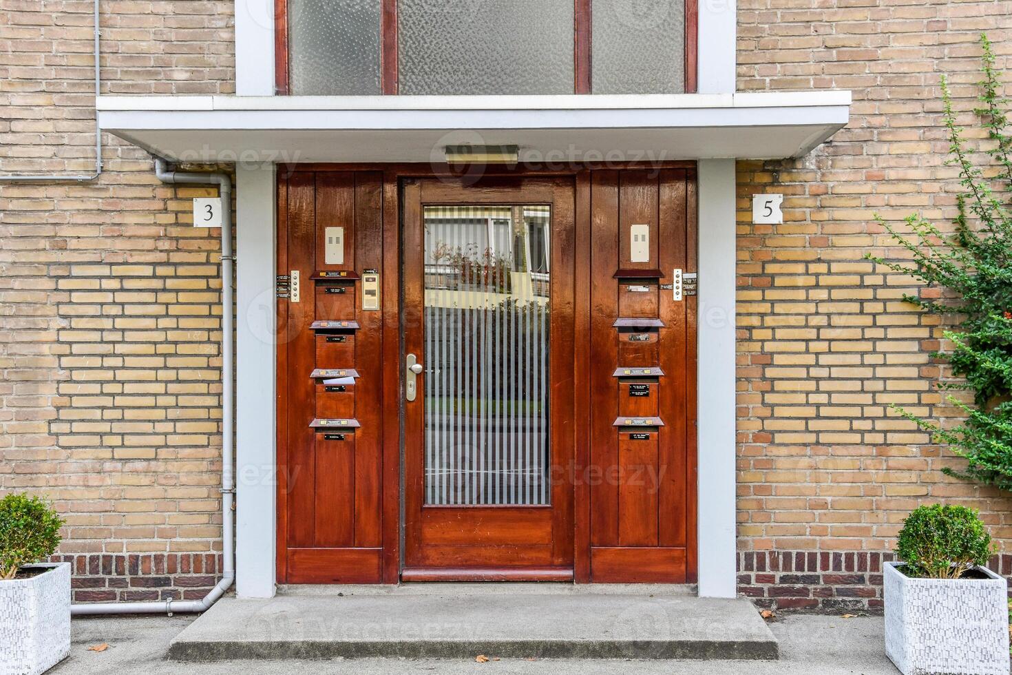 A brown door with a white frame photo