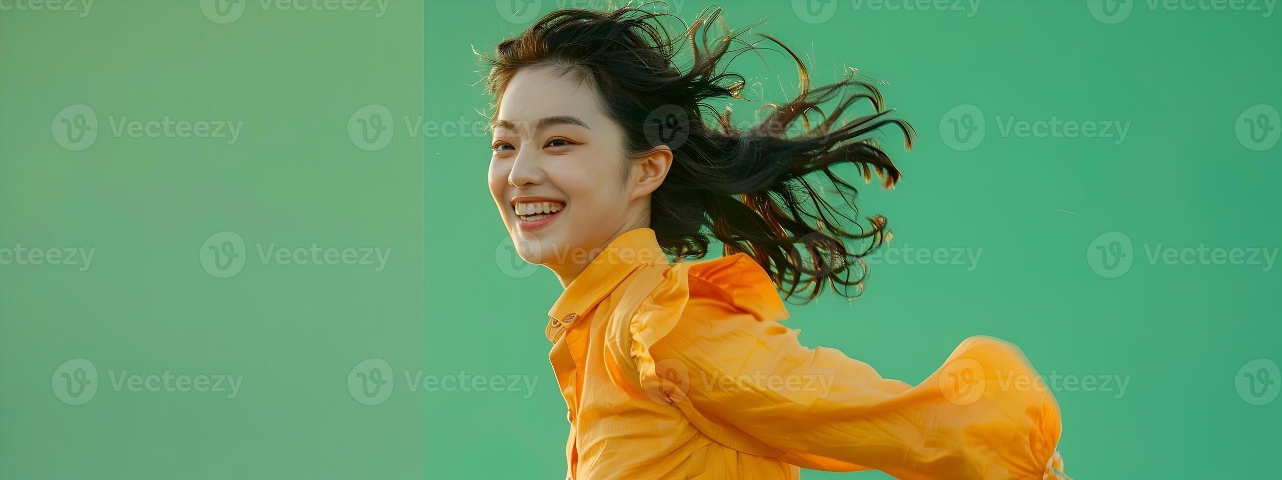 Lively Portrait of a Smiling Hallyu Woman Running with Modern Costume Against Green Background photo