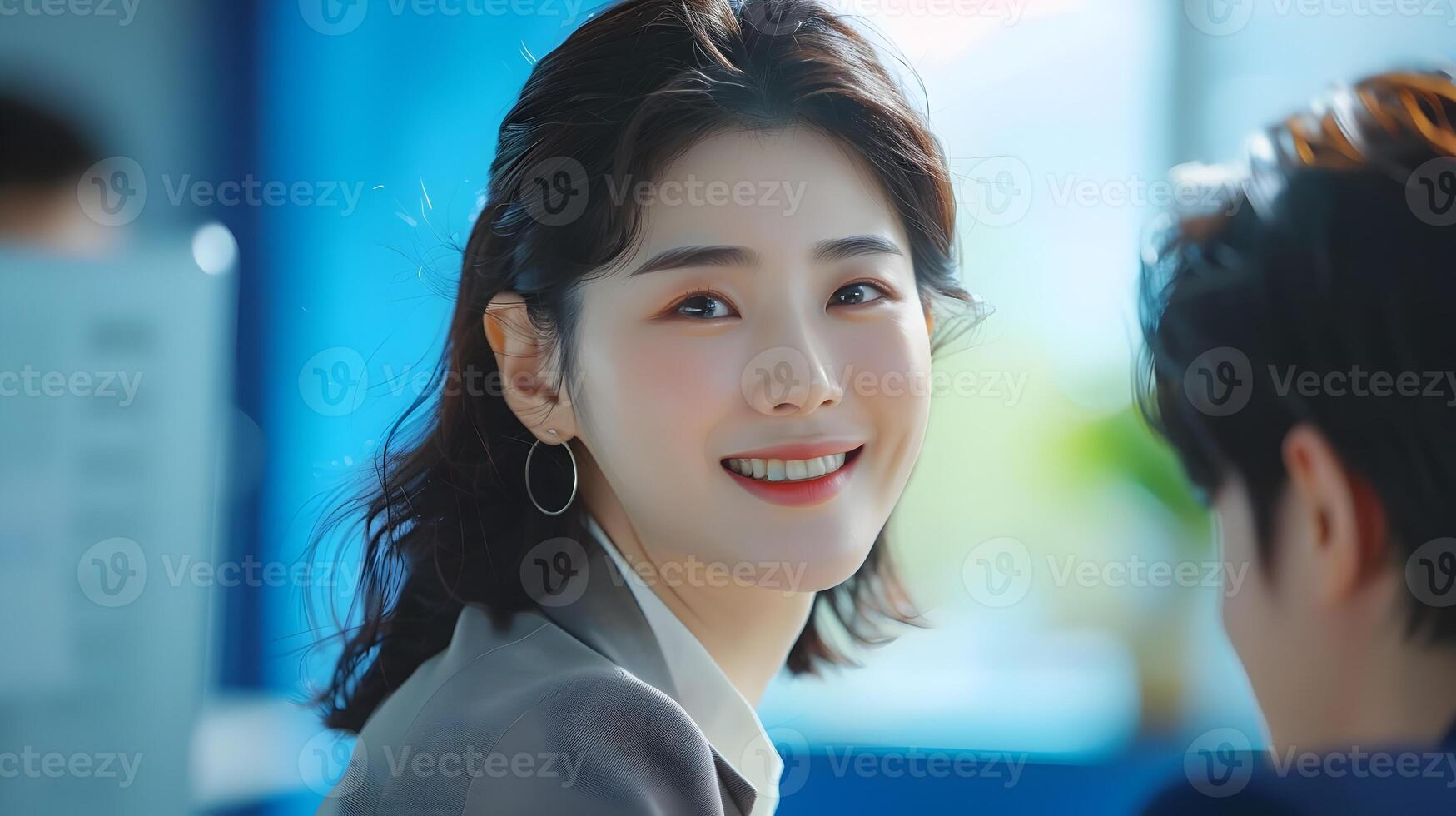 Smiling Young Hallyu Businesswoman in Corporate Office Setting photo
