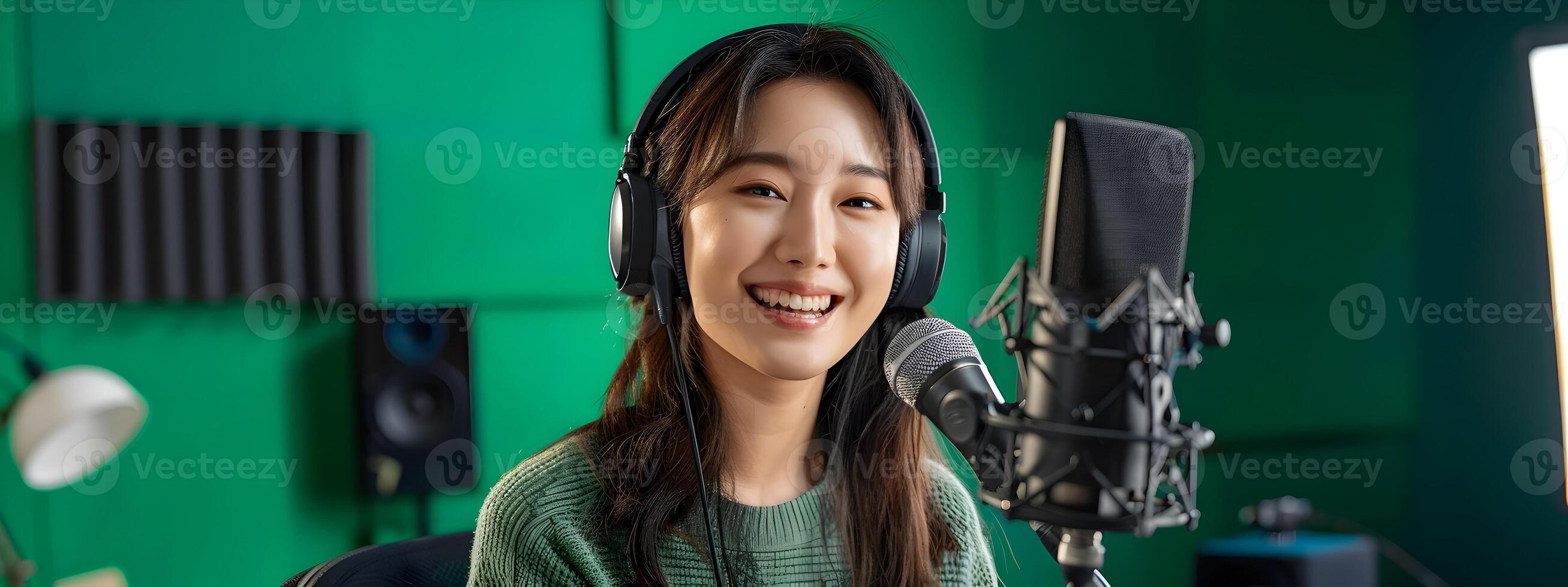 Smiling Young Hallyu Woman Conducting Online Recording and Remote Training with Neo Pop Sensibility on Green Screen photo