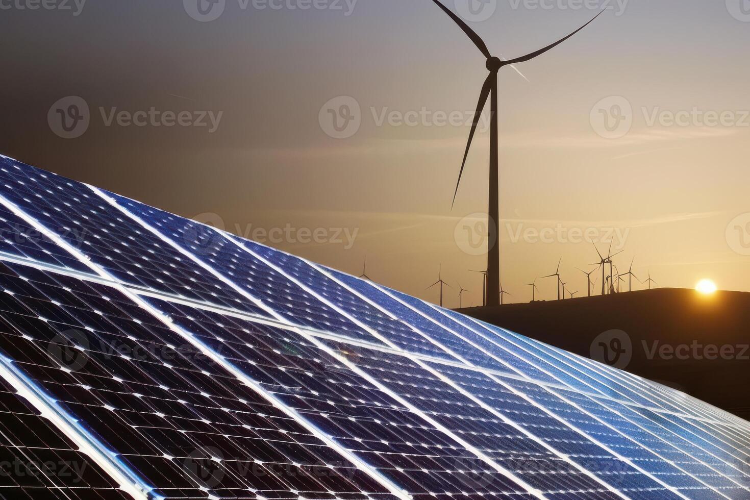 Solar panels and wind turbines at sunset photo