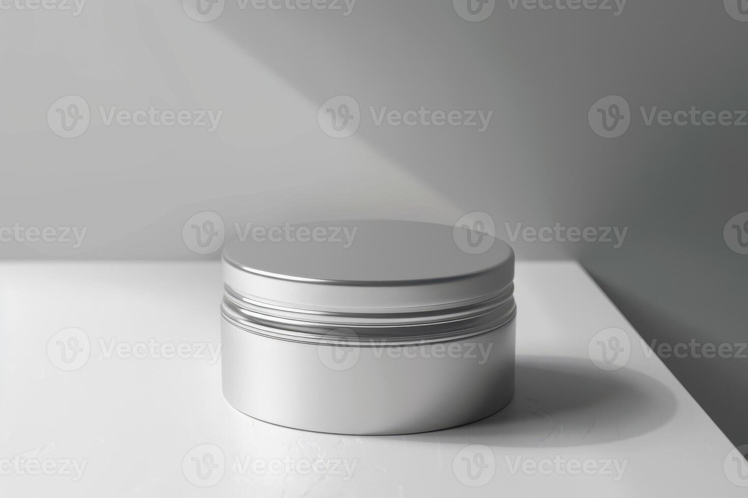 A silver container with a lid sitting on a table photo