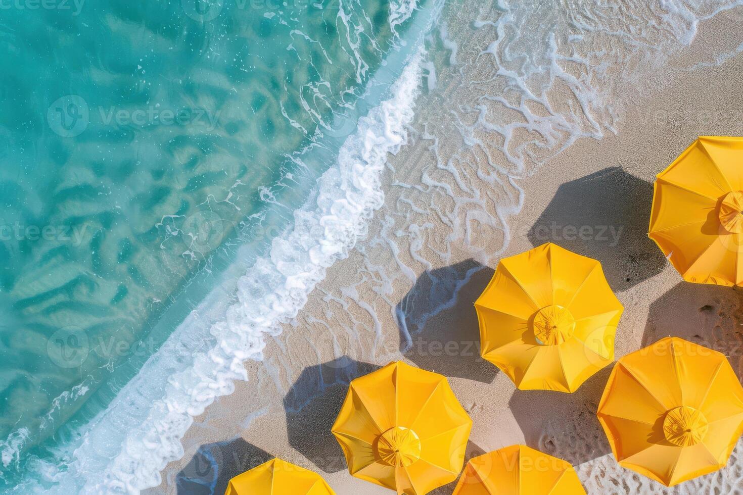 A view of several yellow umbrellas on a beach photo