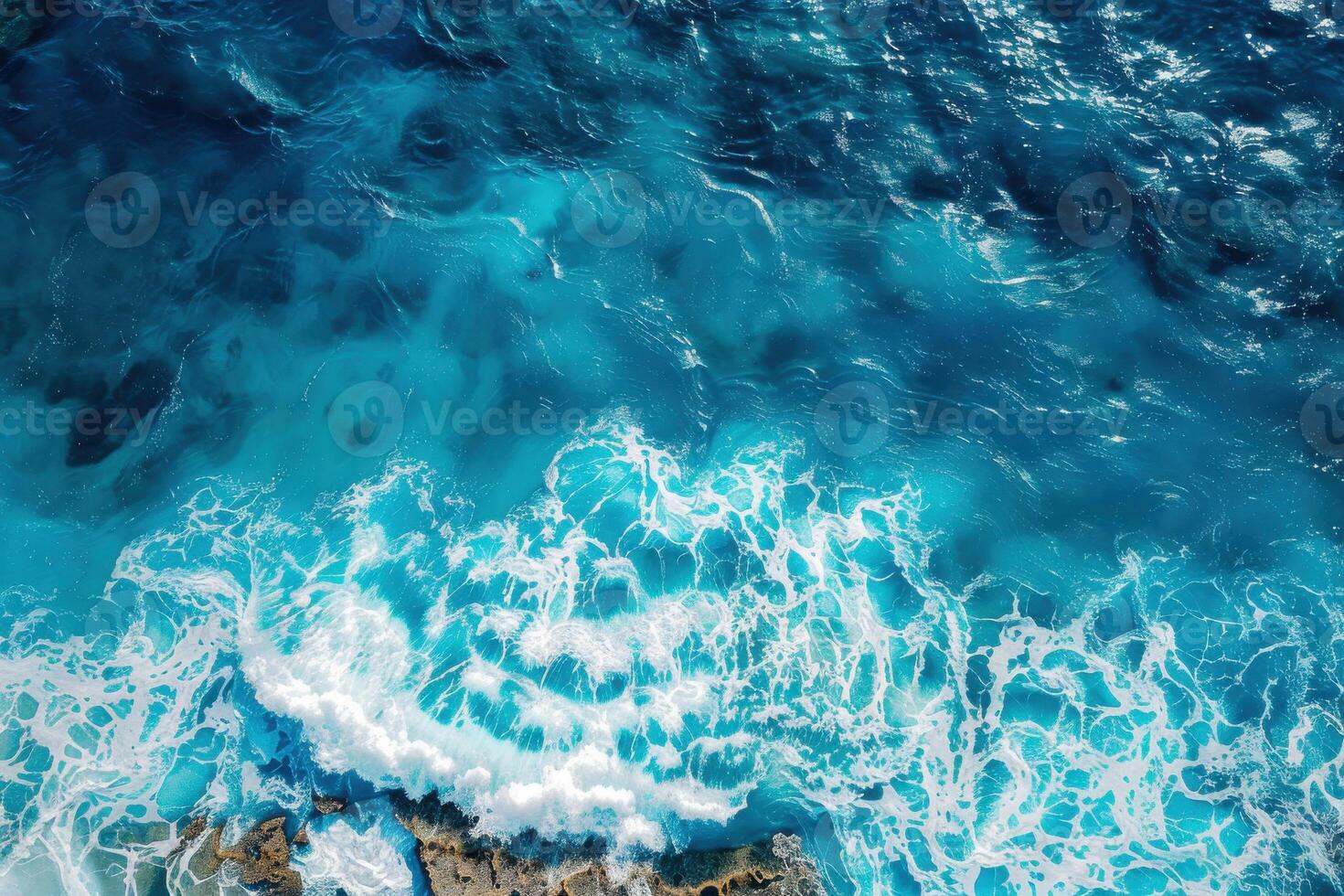 An aerial view of the ocean and waves photo
