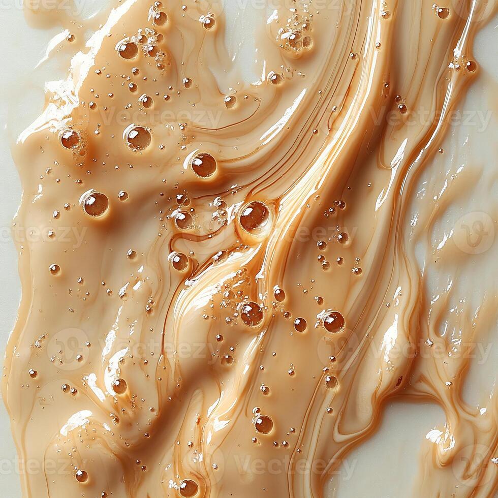 Drizzle of caramel sauce creating an abstract pattern on a pristine white background smooth and glossy photo