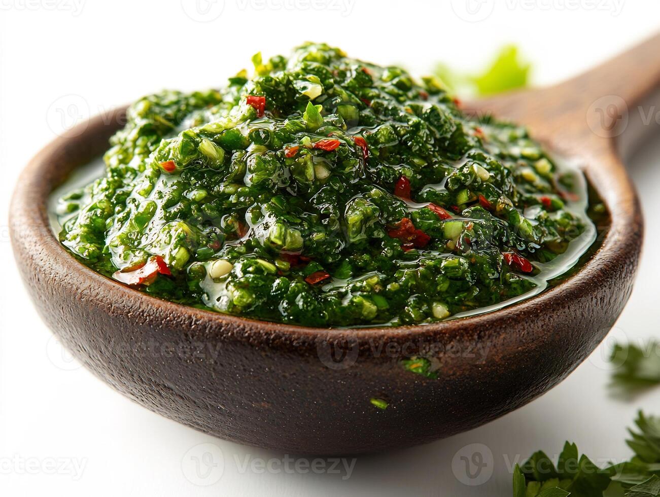 Spoonful of spicy green chutney placed on a clean white background vibrant and bold in color photo