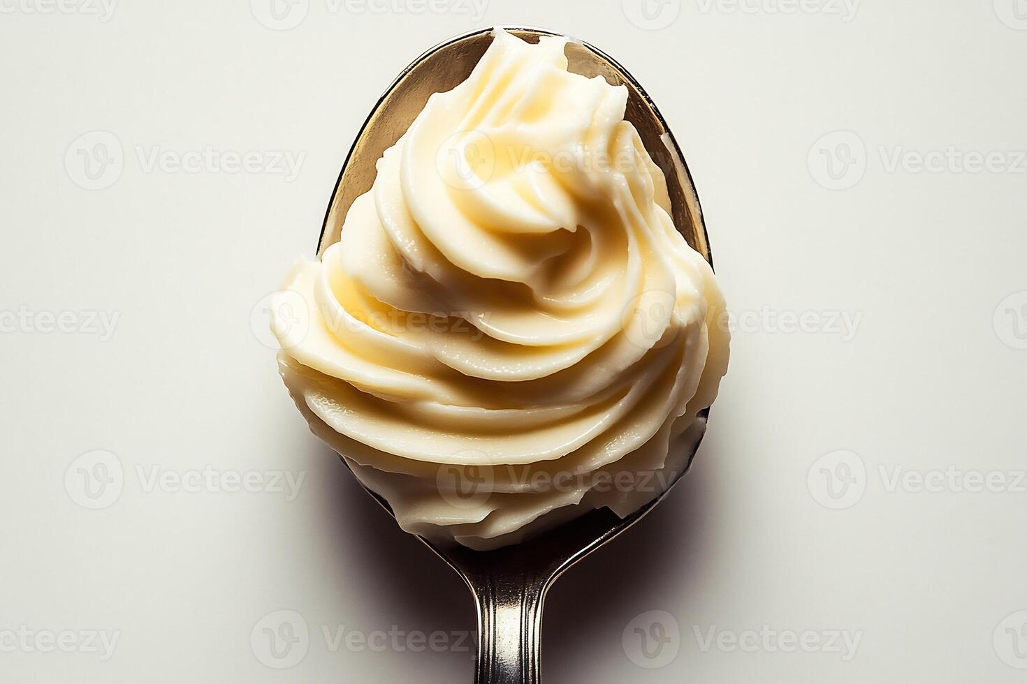 Spoonful of thick yogurt sauce placed in the center of a white background minimalistic and fresh photo