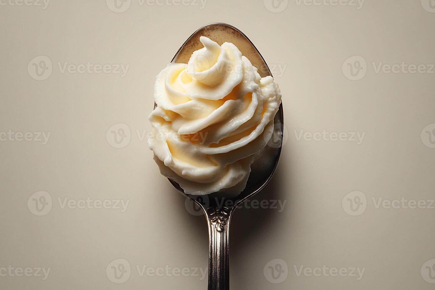 Spoonful of thick yogurt sauce placed in the center of a white background minimalistic and fresh photo