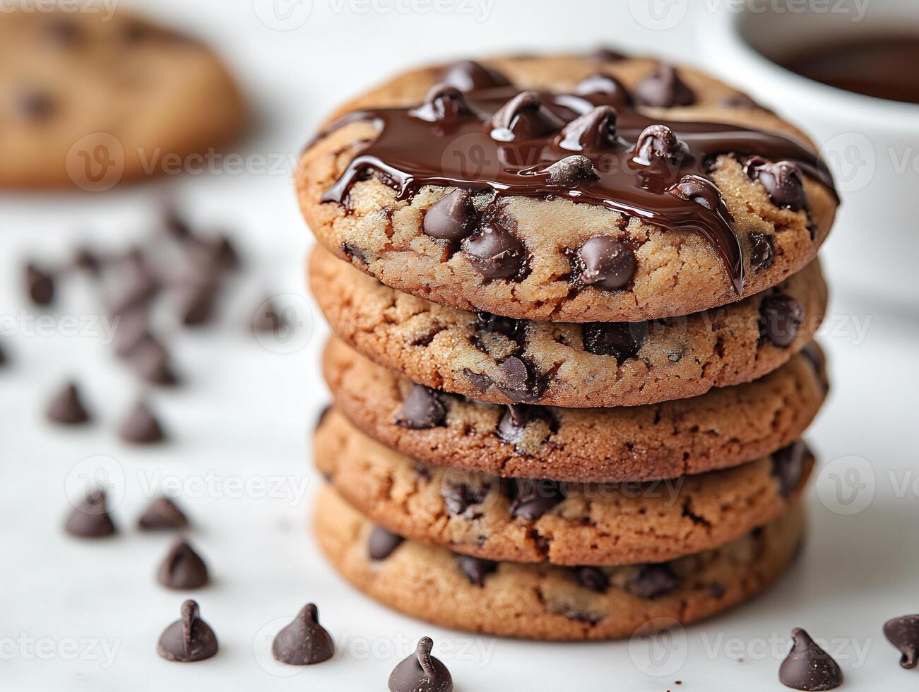 Stack of chocolate chip cookies with melted chocolate drizzled on a clean white background rich and indulgent photo