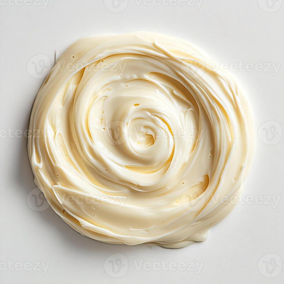Swirl of creamy Alfredo sauce on a pristine white background smooth and rich in texture photo