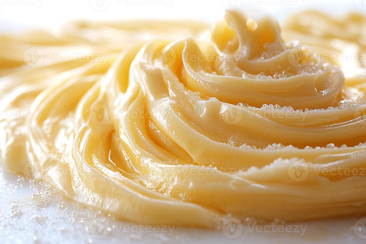 Swirl of creamy cheese sauce artistically drizzled on a white background smooth and rich in texture photo