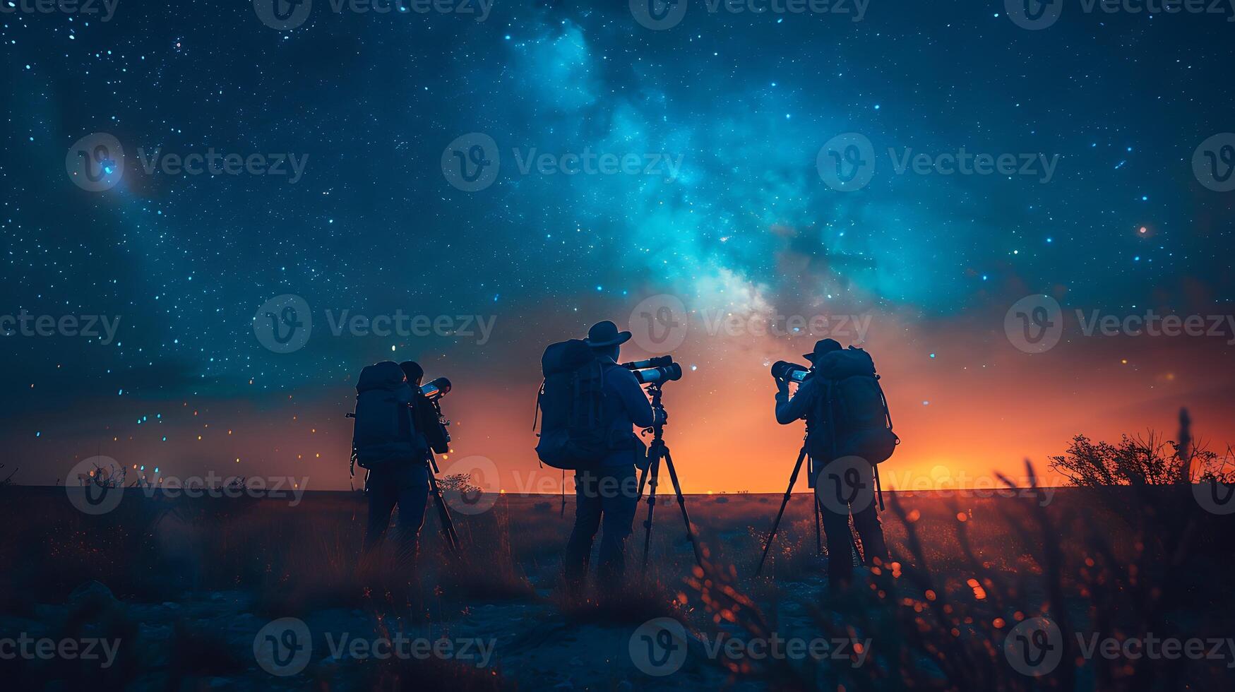 Atmospheric long exposure image of a team of astronomers observing the night sky through telescopes with movements and celestial objects frozen in time photo
