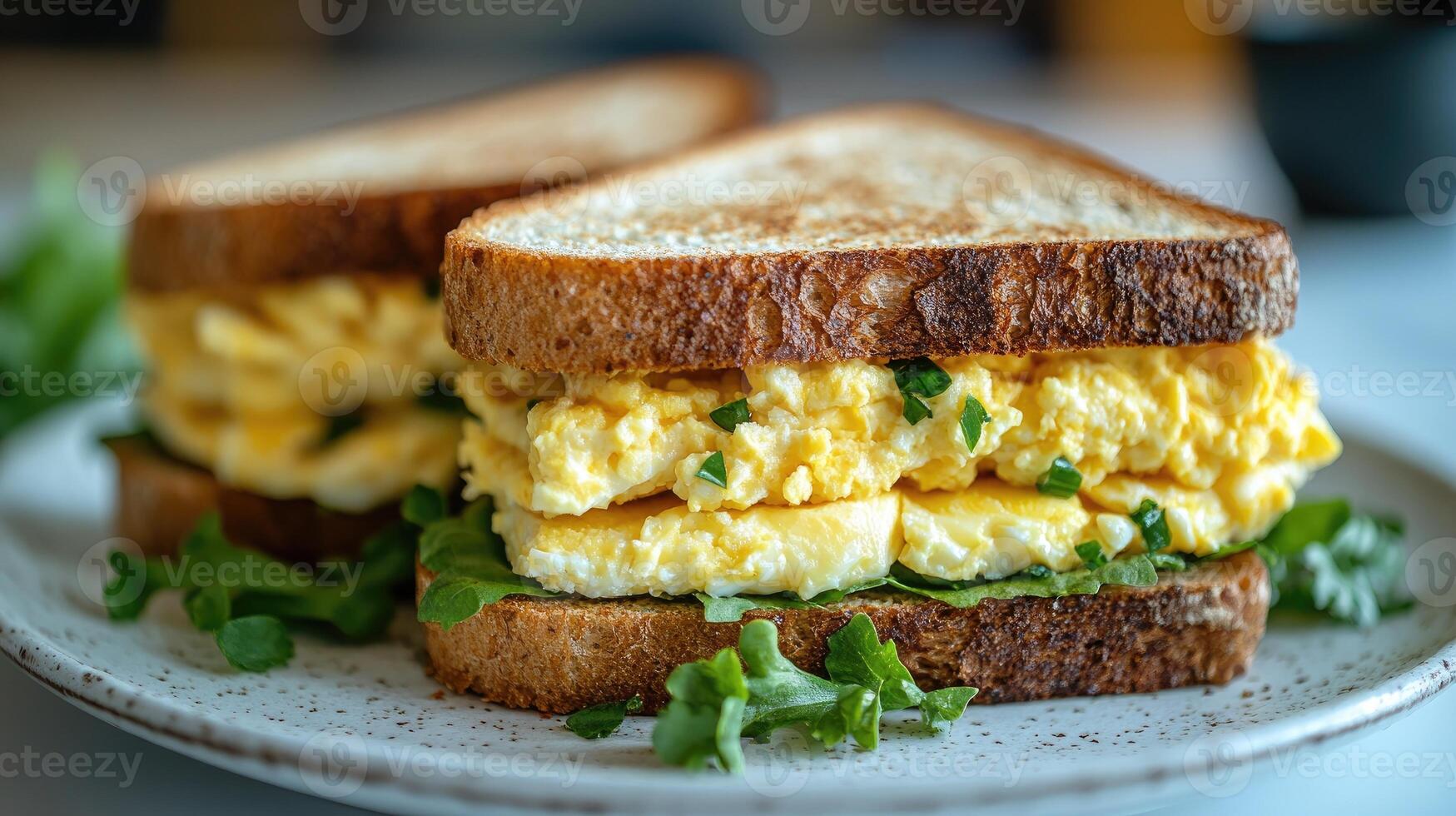 Delicious egg sandwich on toasted bread with parsley garnish photo
