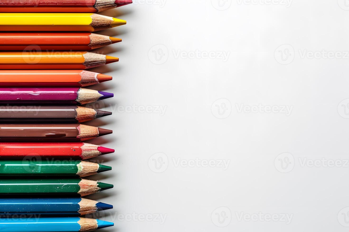 Colorful Assorted Pencils in a Row on White Background - Perfect for Art and School Projects photo