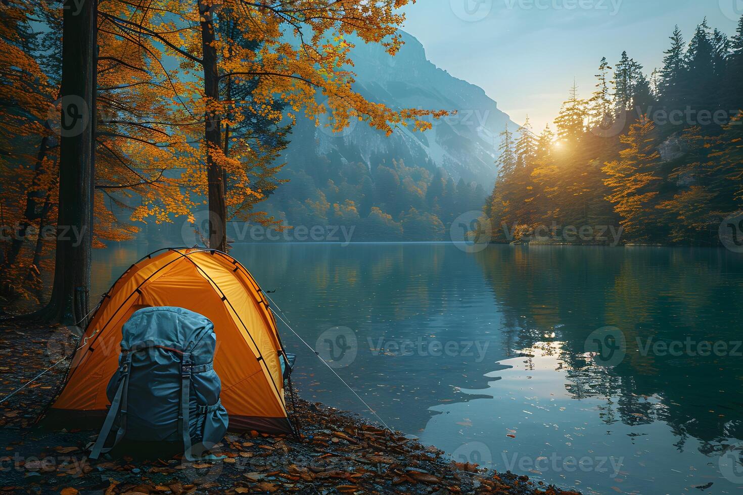 Autumn Camping by Serene Lake in the Forest with Vibrant Foliage and Misty Mountains - Outdoor Adventure Concept photo