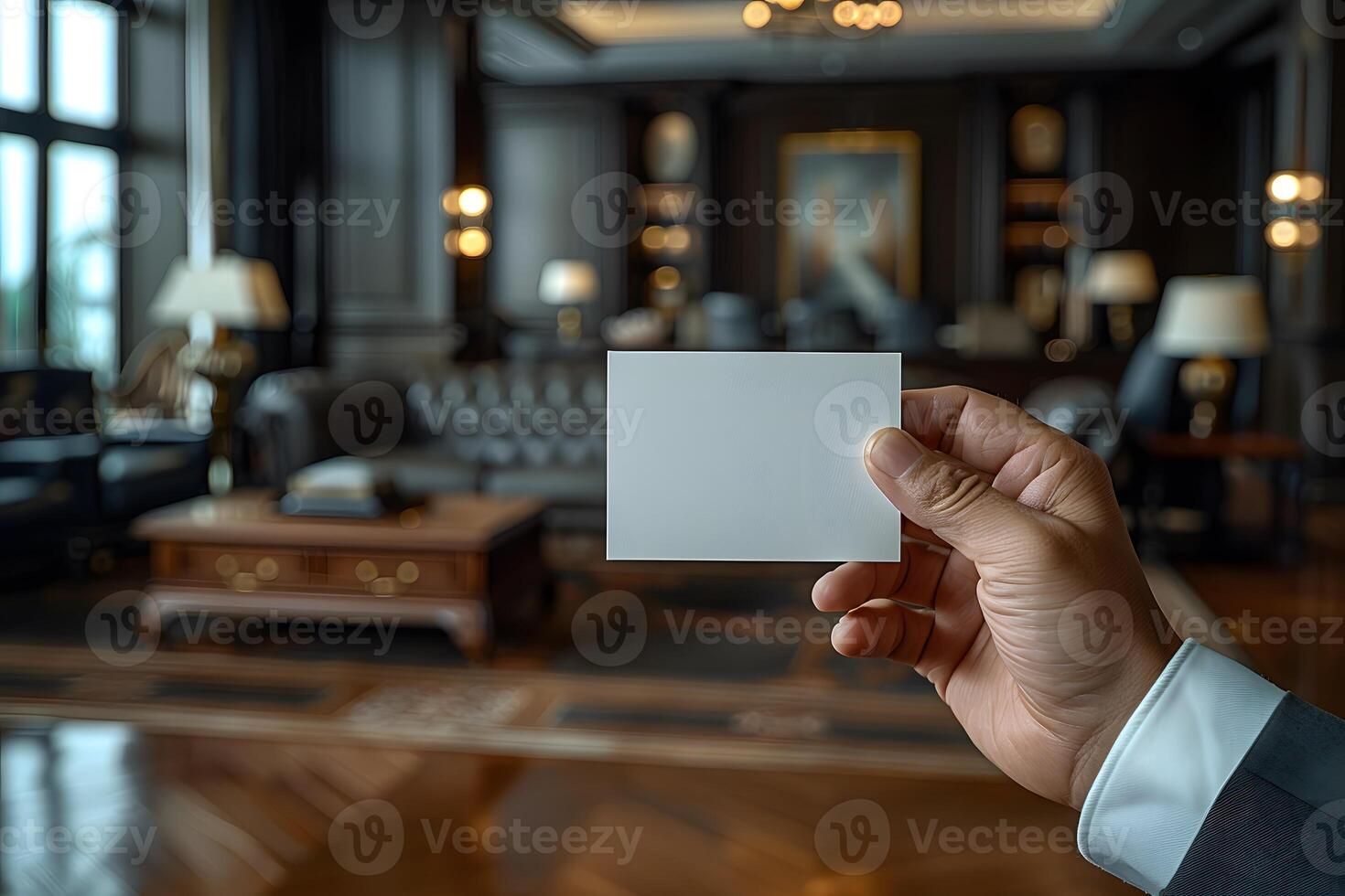 Business Concept Hand Holding Blank Card in Luxurious Office Interior for Creative Design, Branding, Presentation photo