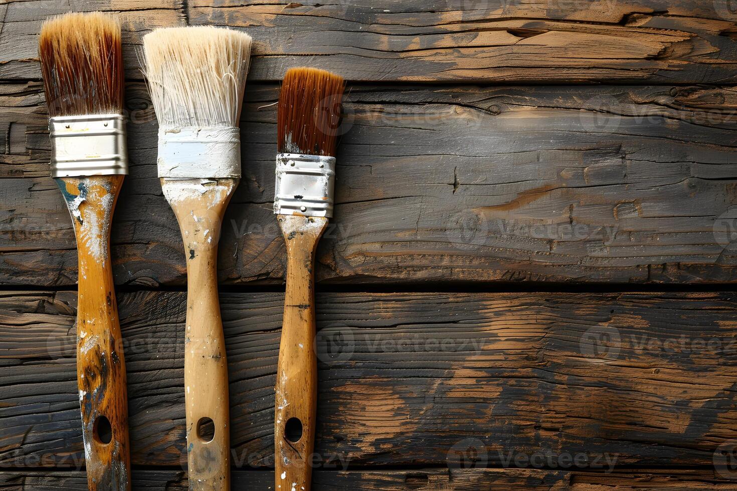 Aged Wooden Brushes on Weathered Wood Plank Background Ideal for Artistic Concepts, Design Projects, and Vintage Themes photo