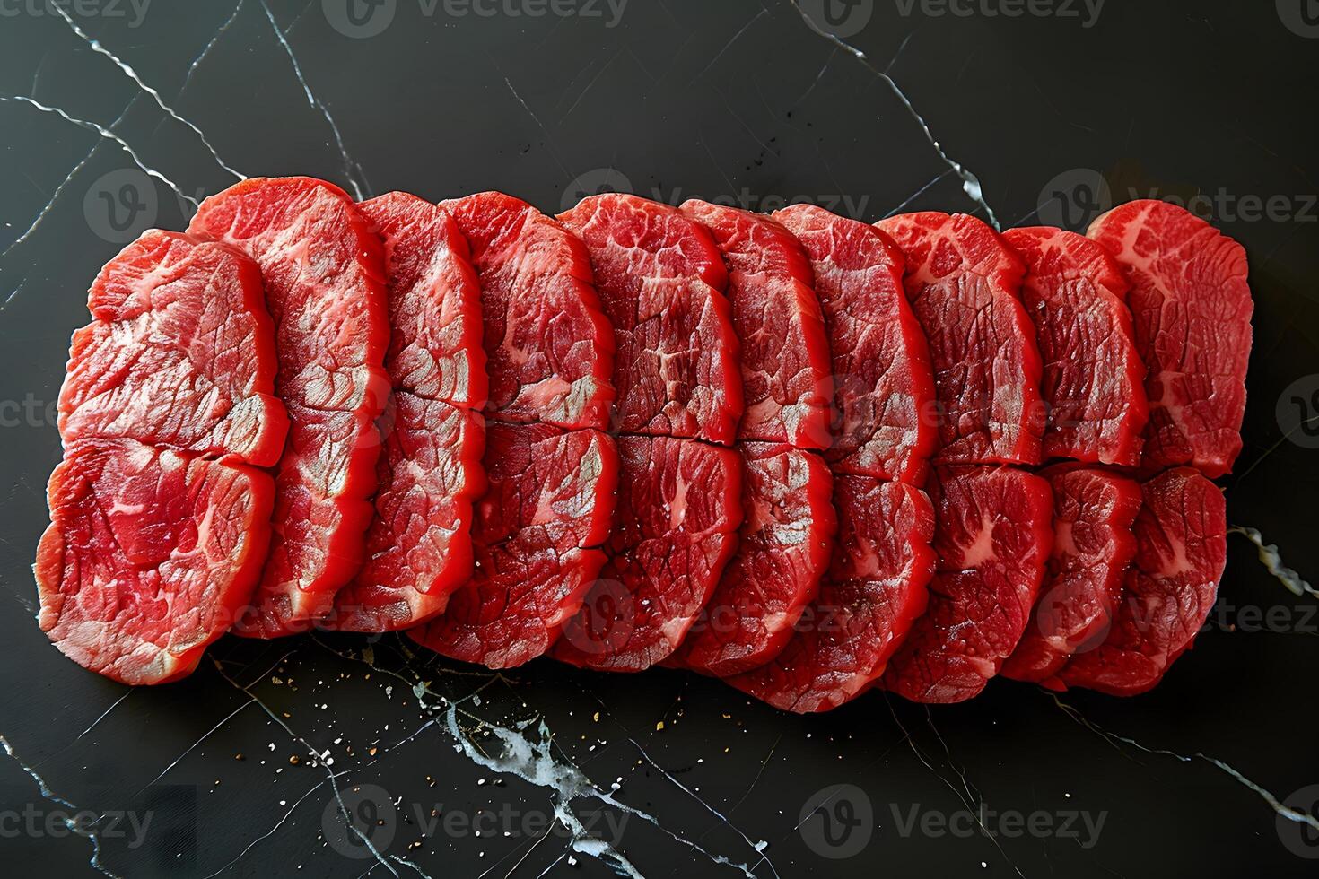 Fresh Slices of Raw Beef Steak on Black Marble Background - Perfect for Cooking and Culinary Designs photo
