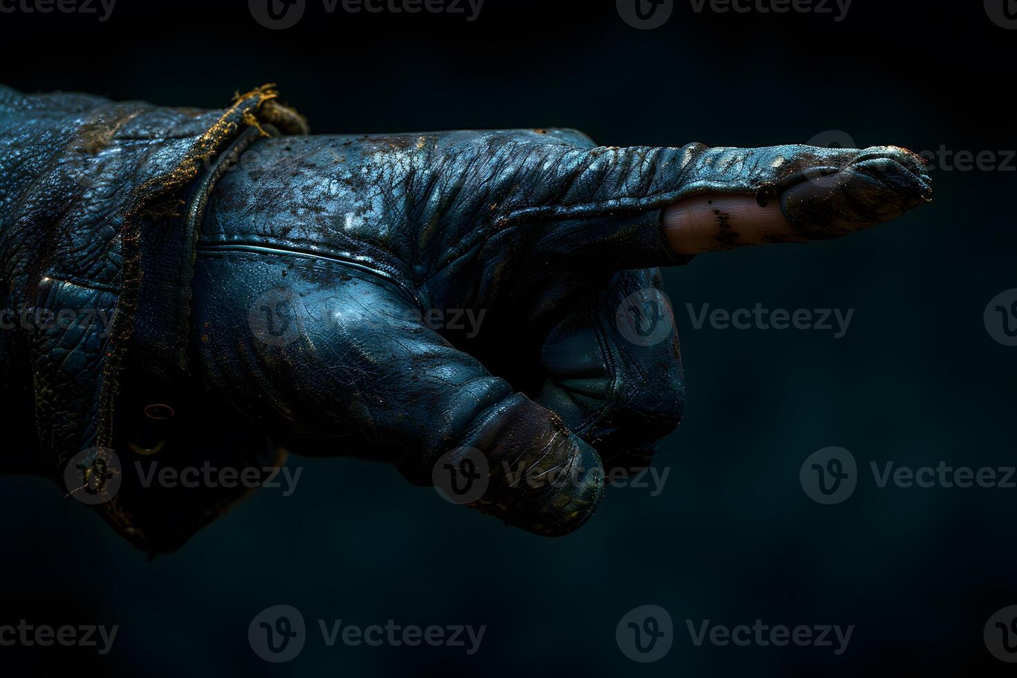 Mysterious Gloved Hand Pointing in Darkness - Mood Concept for Halloween or Adventure Poster photo