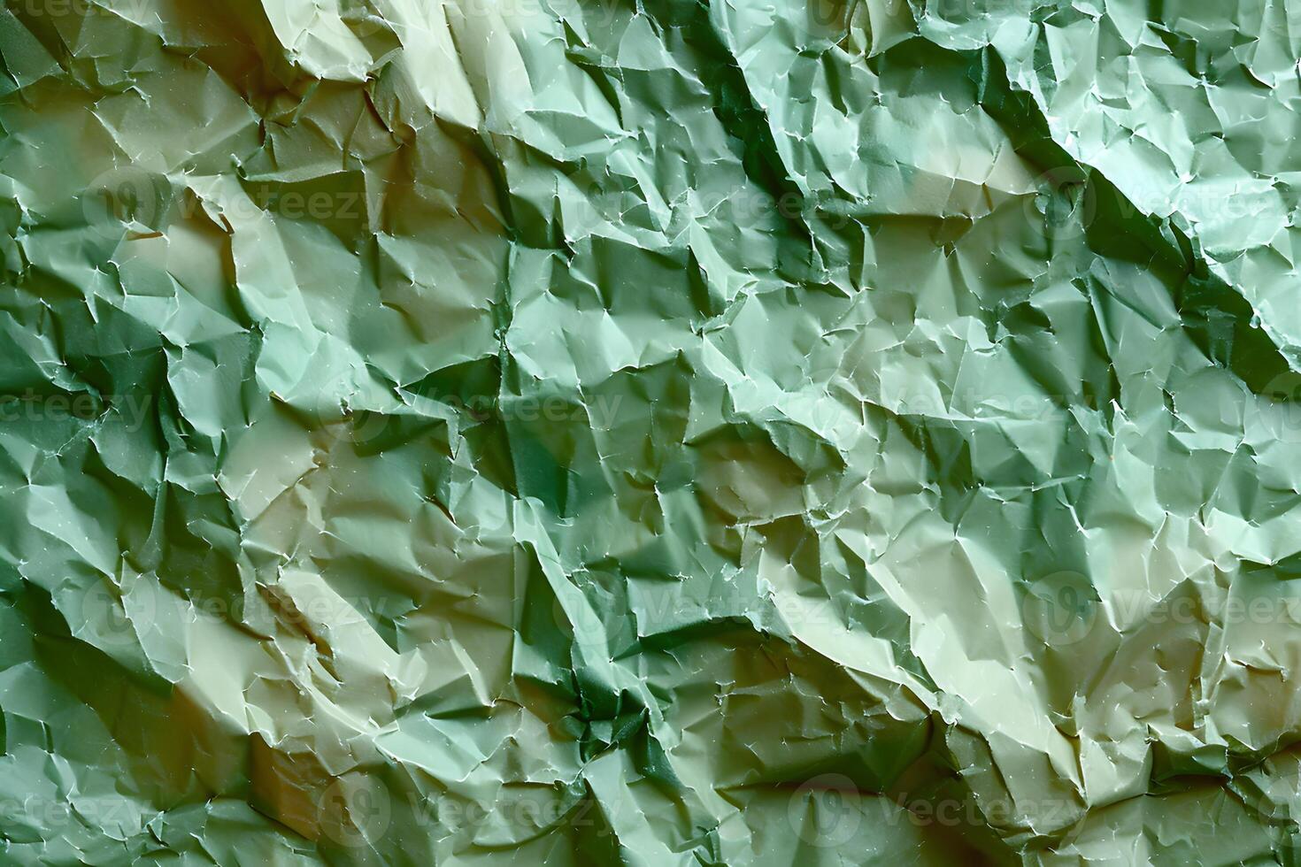 Abstract Crumpled Green Paper Texture for Backgrounds and Designs photo