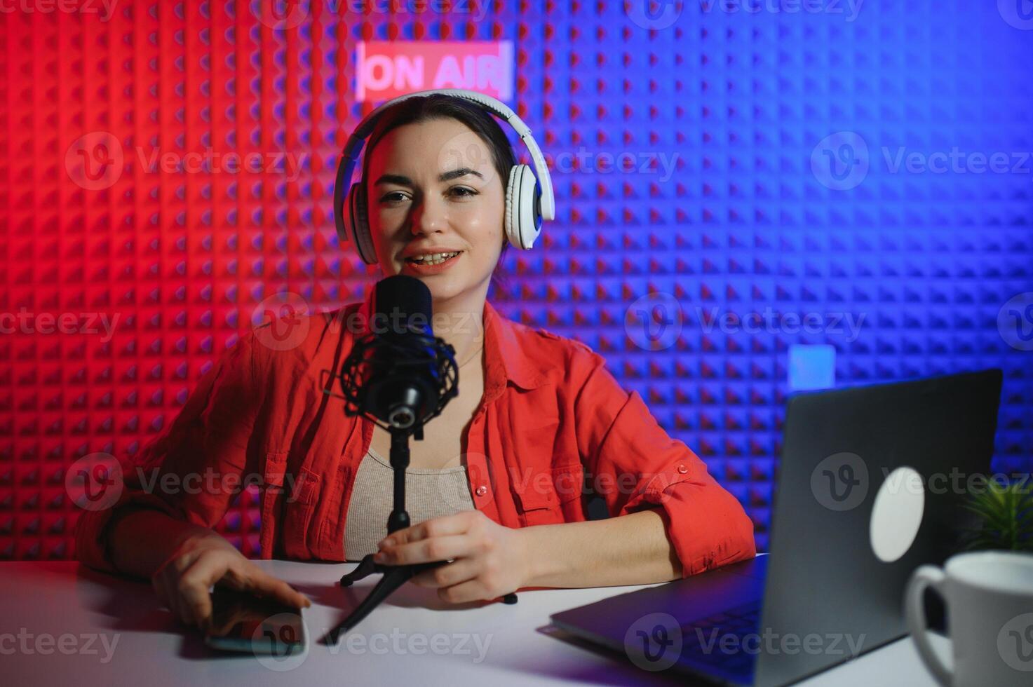 Young woman blogger recording on camera photo