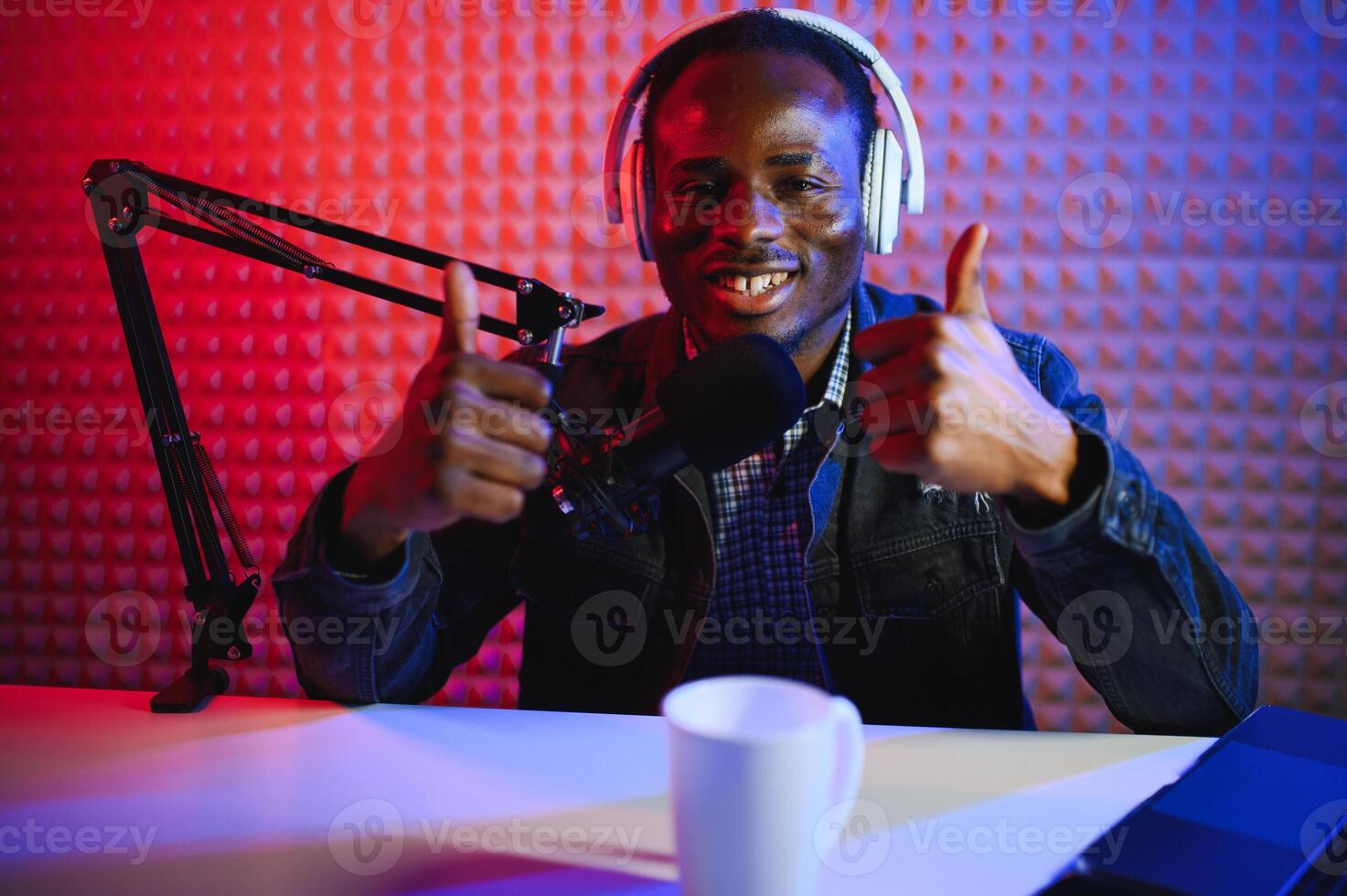 African american blogger records content in his studio. photo