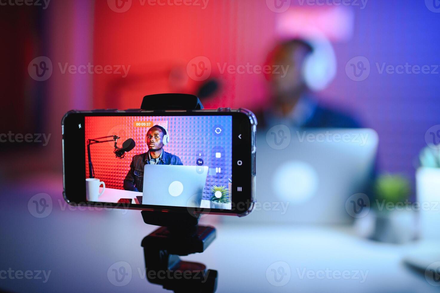 Black male influencer creates material for his internet audience, discussing new trends photo