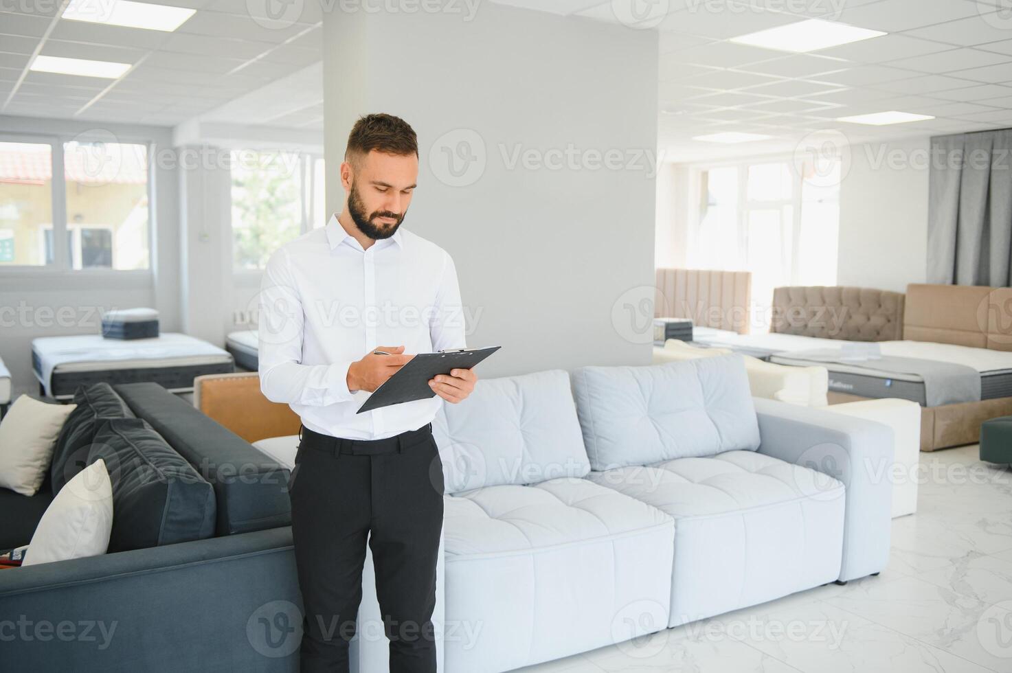 Sales assistant in furniture store photo