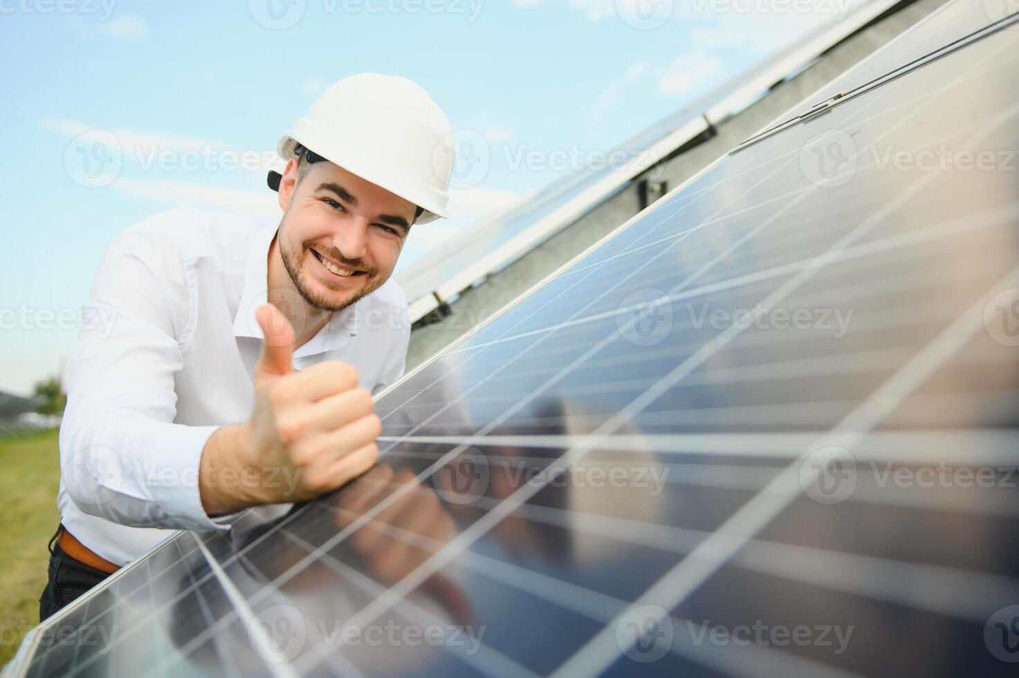 The solar farm, solar panel with engineer check the operation of the system, Alternative energy to conserve the worlds energy, Photovoltaic module idea for clean energy production. photo