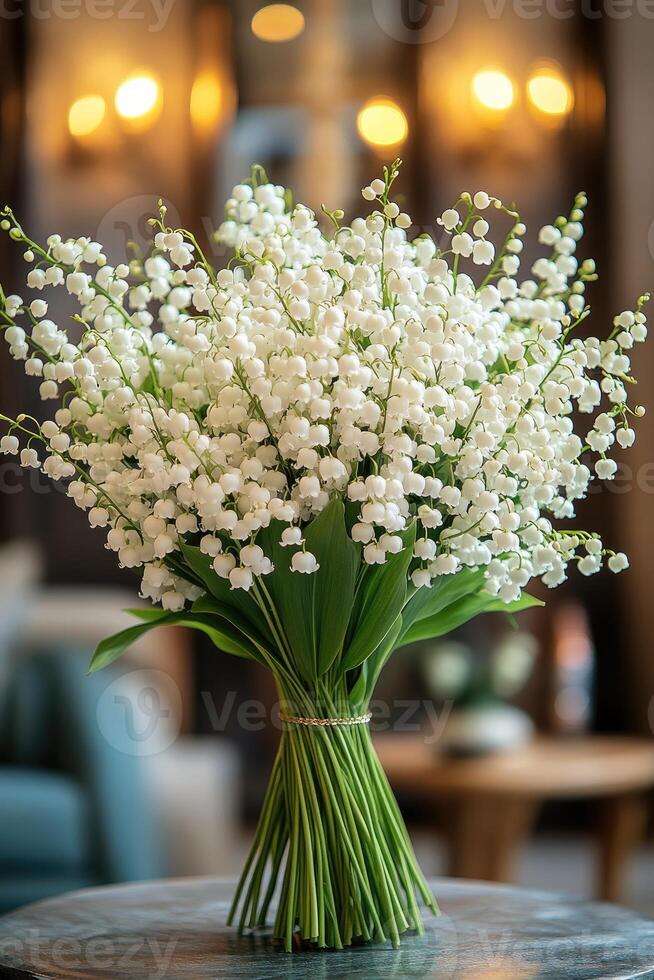 Bouquet of lily of the valley flowers bringing spring inside a cozy home photo