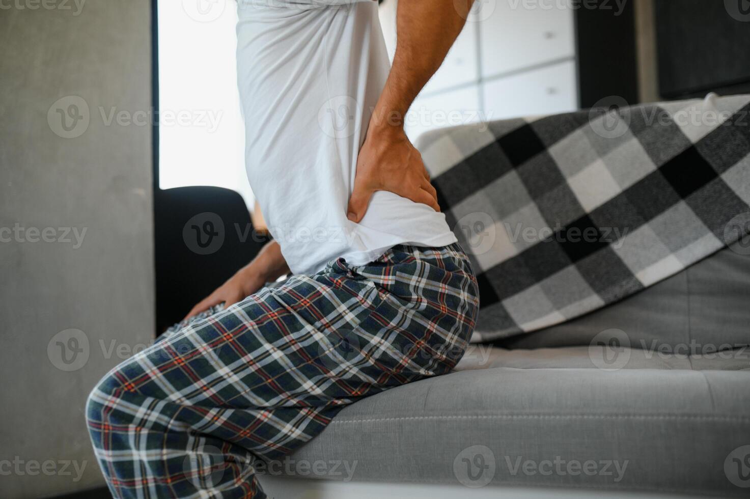 Man suffering from back pain photo