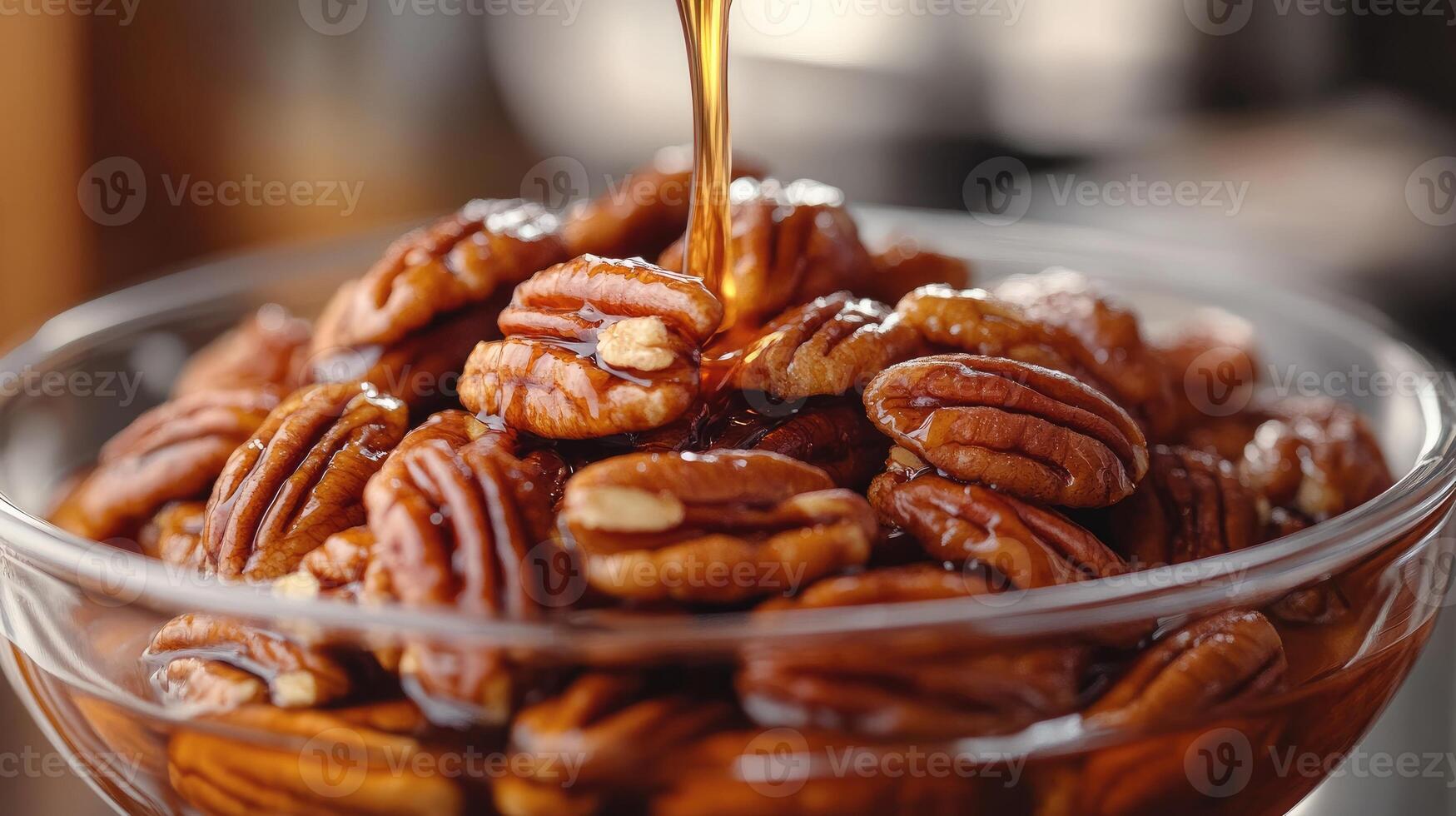 Bowl overflowing with delicious glazed pecans photo