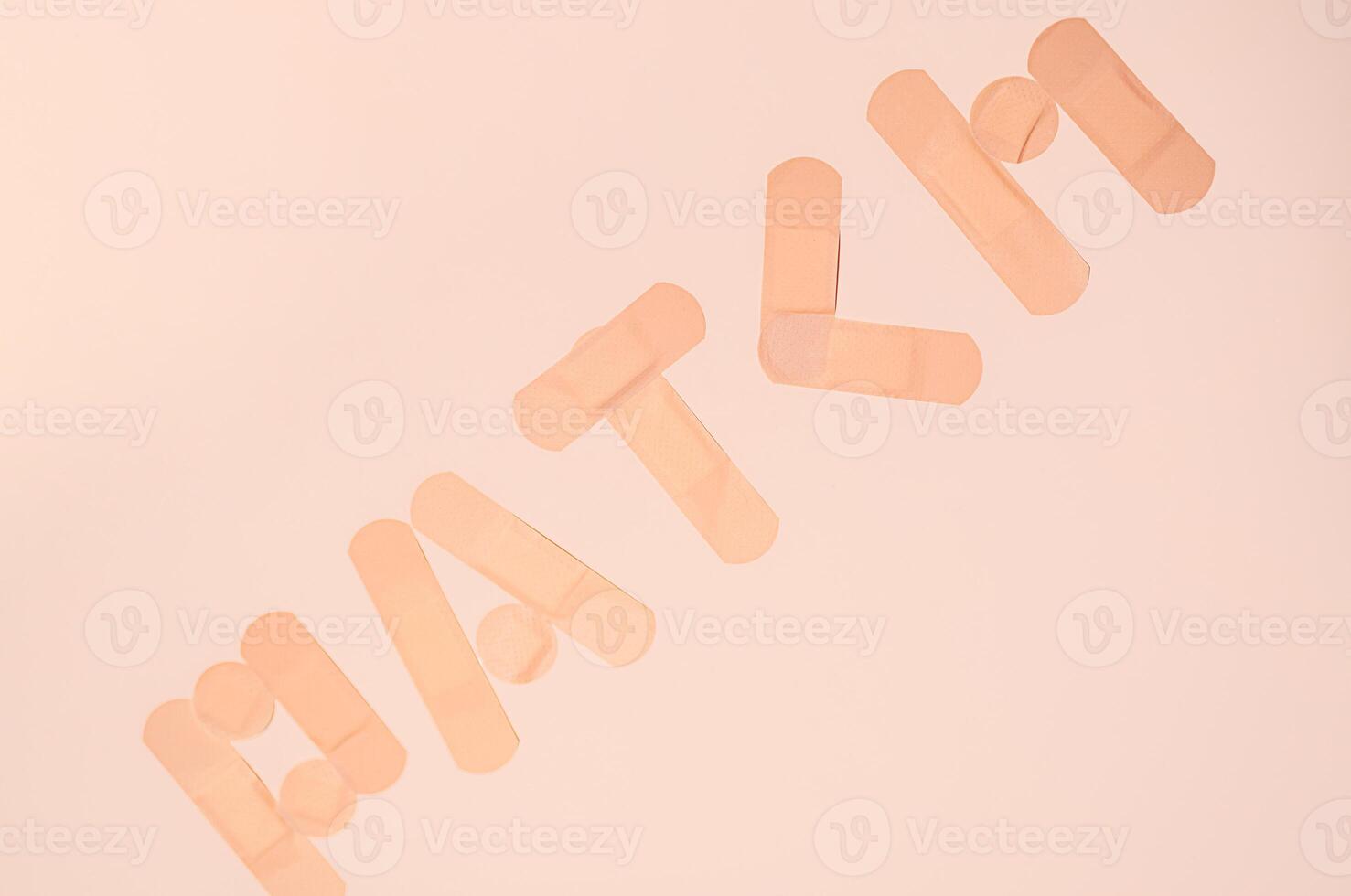 Patch word made from adhesive bandages. photo