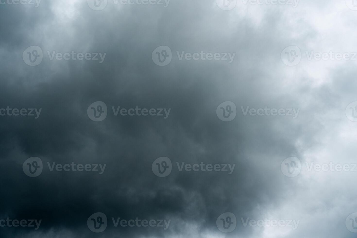 Dark dramatic storm cumulus clouds in autumn. An impending storm, hurricane or thunderstorm. Bad weather. photo