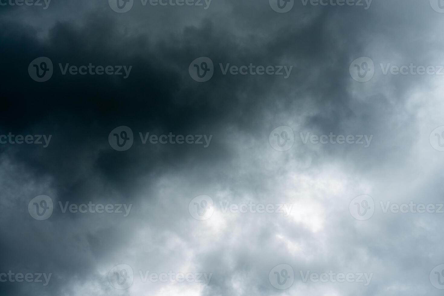 Dark dramatic storm cumulus clouds in autumn. An impending storm, hurricane or thunderstorm. Bad weather. photo