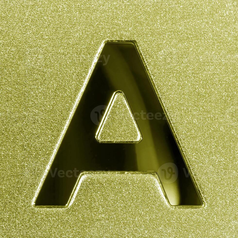 Letter A on a golden grained shiny metal surface. English alphabet. photo