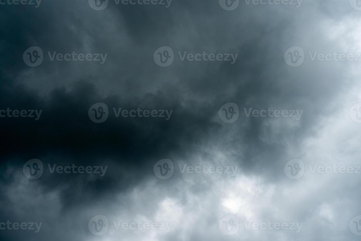Dark dramatic storm cumulus clouds in autumn. An impending storm, hurricane or thunderstorm. Bad weather. photo