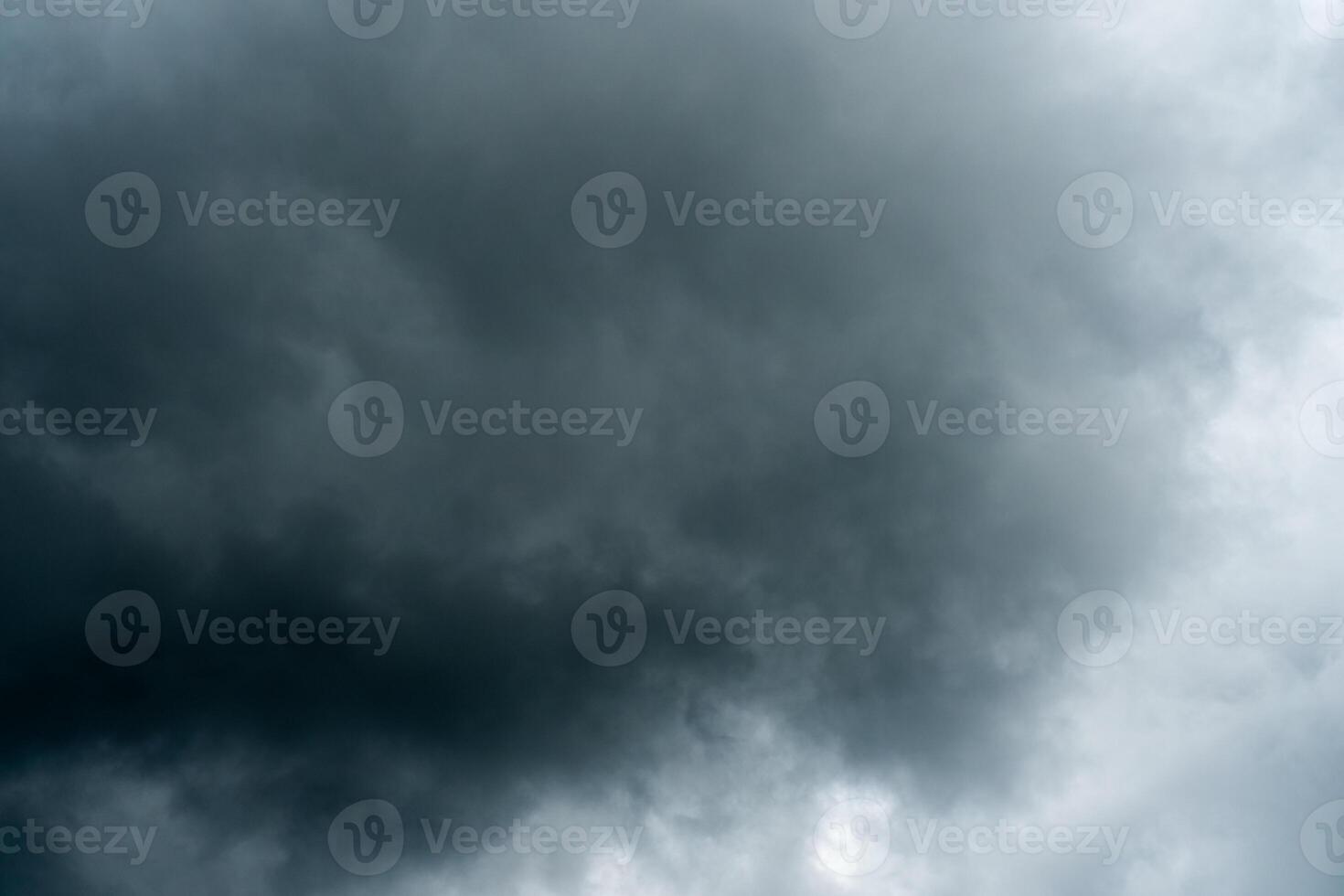 Dark dramatic storm cumulus clouds in autumn. An impending storm, hurricane or thunderstorm. Bad weather. photo