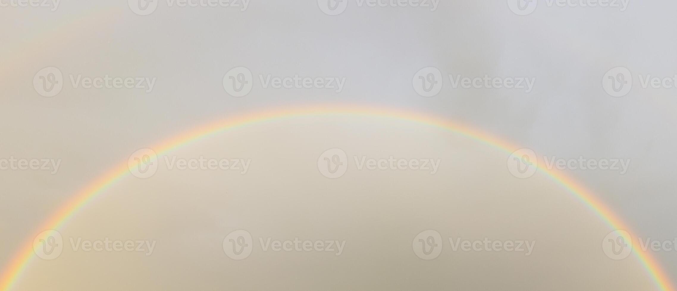 Rainbow against sunset sky. Natural background. Weather after rain. photo