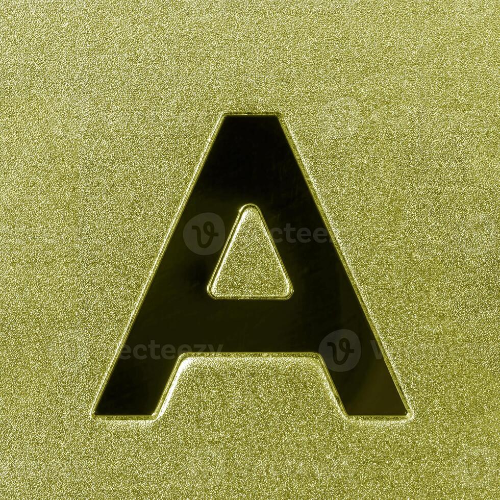 Letter A on a golden grained shiny metal surface. English alphabet. photo