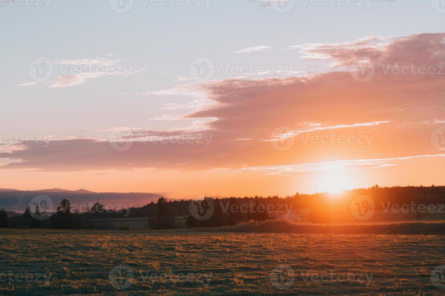 Golden sky transitions smoothly at sunset, creating a serene evening sky photo