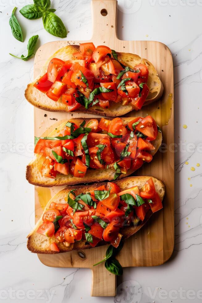tomato bruschetta topped with fresh basil on crispy bread photo