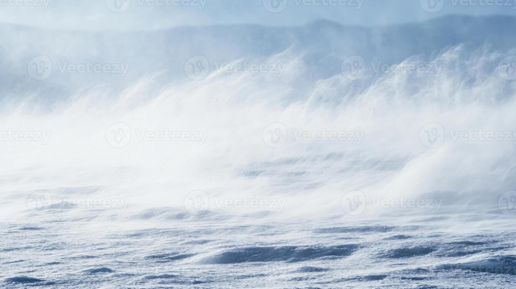 A large body of water with a lot of white spray coming out of it photo