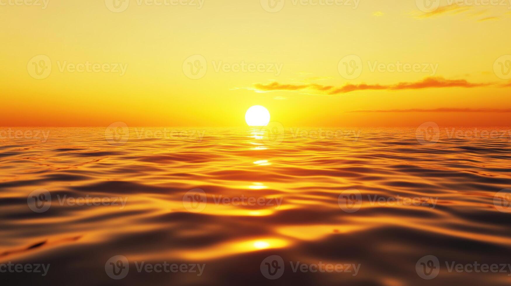 The sun is setting over the ocean, casting a warm glow on the water photo