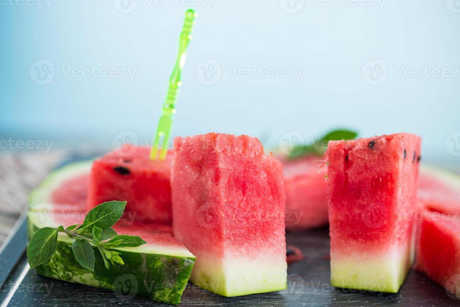 pieces of ripe red watermelon, close-up, on a board photo